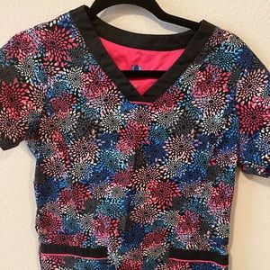 Bright colored, floral scrub top